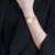 TISSOT天梭 弗拉明戈系列石英白色贝母盘钢带女士腕表(30mm) T094.210.33.116.01第3张高清大图