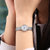 天梭（TISSOT）手表 乐爱系列1853石英小金表  瑞士手表  时尚女士钢带手表(T058.009.11.031.00)第4张高清大图