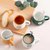 马克杯情侣宿舍创意陶瓷杯子男可爱喝水杯女家用咖啡牛奶茶杯夏季(男孩（白+绿) 带盖+送勺子)第2张高清大图