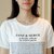 娇维安 夏季韩版女装中长款圆领体恤衫 宽松字母开叉短袖t恤女(黑色 S)第3张高清大图